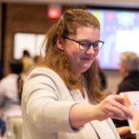 person handing in table number